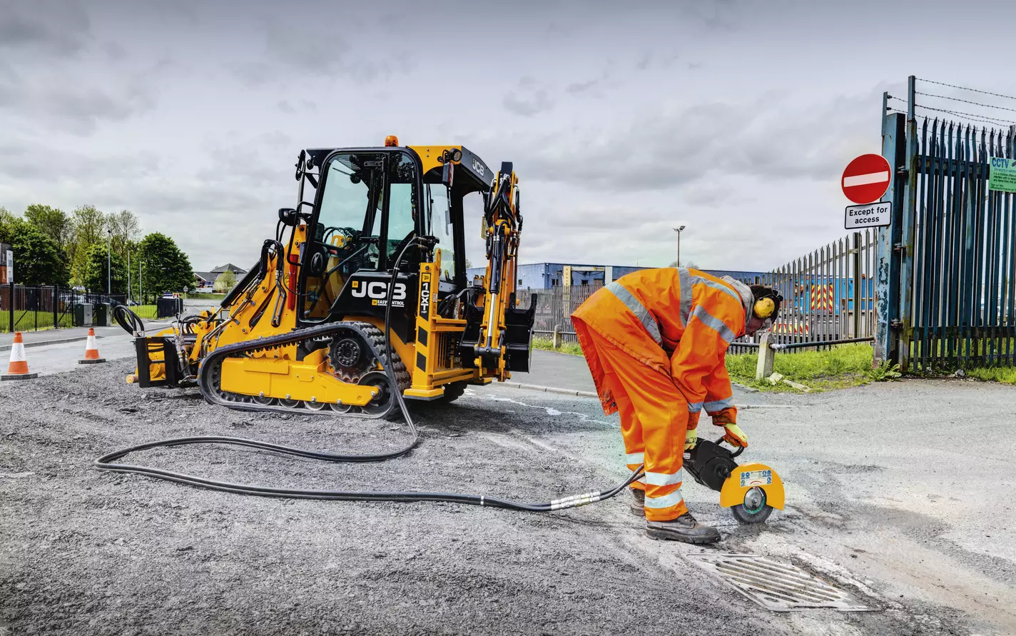 JCB 1CXT and operator on a Perth utility works site